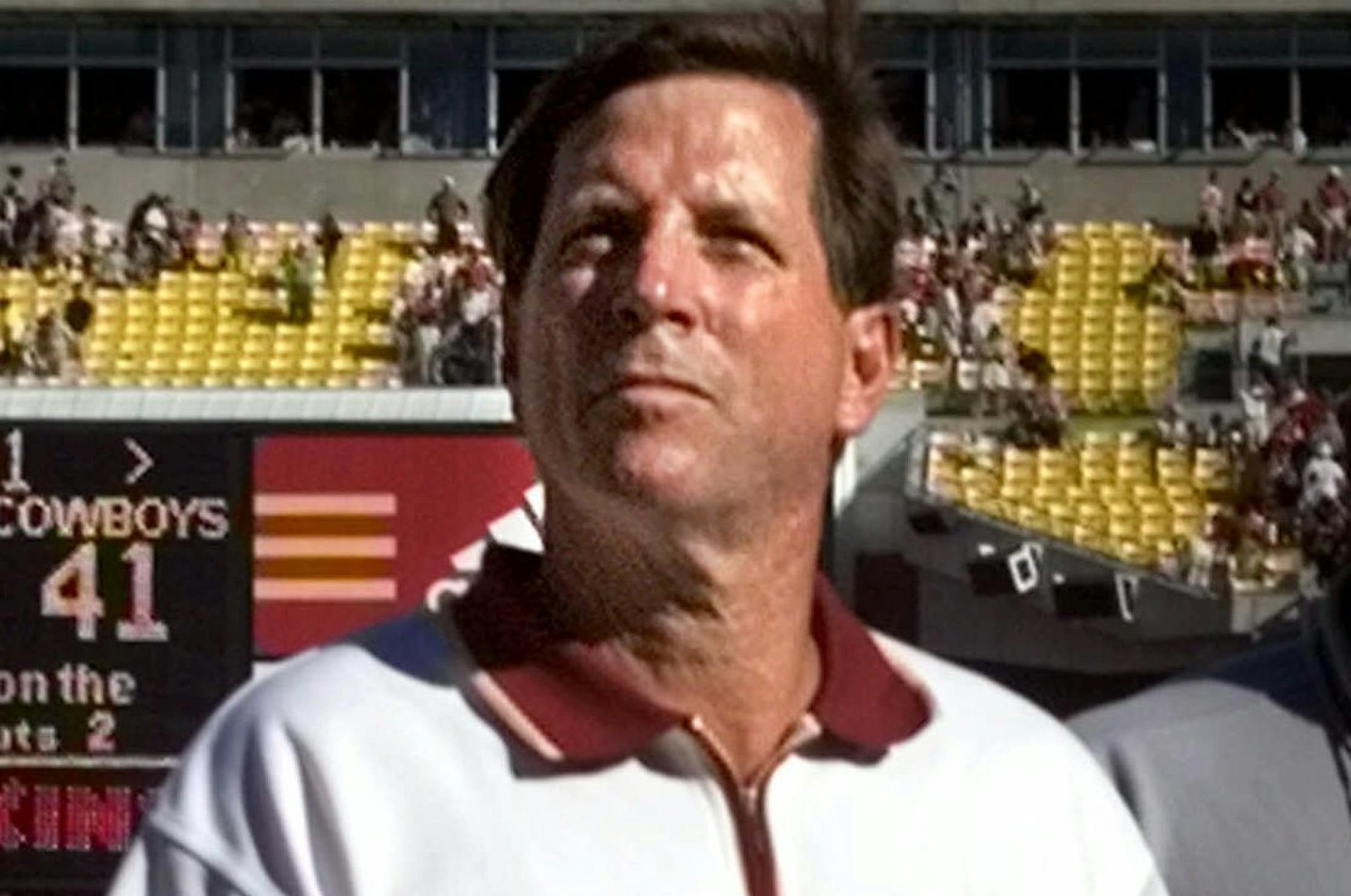 Washington Redskins head coach Norv Turner walks off the field following his team's overtime loss to the Dallas Cowboys at Redskins Stadium Sunday, Sept. 12, 1999, in Landover, Md. Turner came into the season on the hot seat and things have only gotten worse for the Redskins coach after one game. Not only didn't the Redskins win their first game for new owner Daniel Snyder, they blew a 21-point fourth-quarter lead and eventually dropped a 41-35 decision in overtime to the Cowboys. (AP Photo/Khue