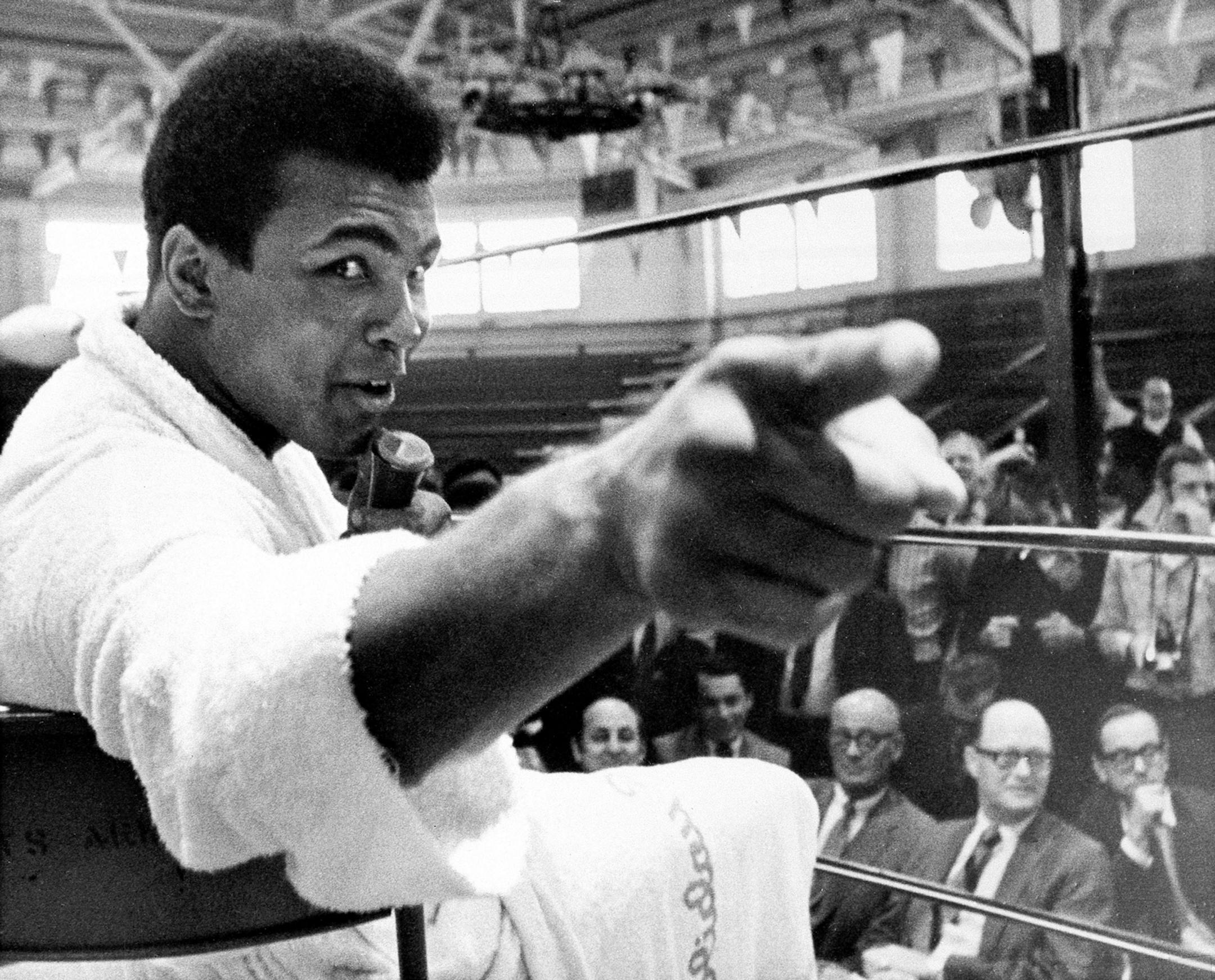 Heavyweight boxer Muhammad Ali makes a point during a news conference that he conducts from inside the ring in Atlanta, Ga., Oct. 24, 1970. The former heavyweight champion meets Jerry Quarry in a 15-round non-title fight Oct. 26 in Atlanta.