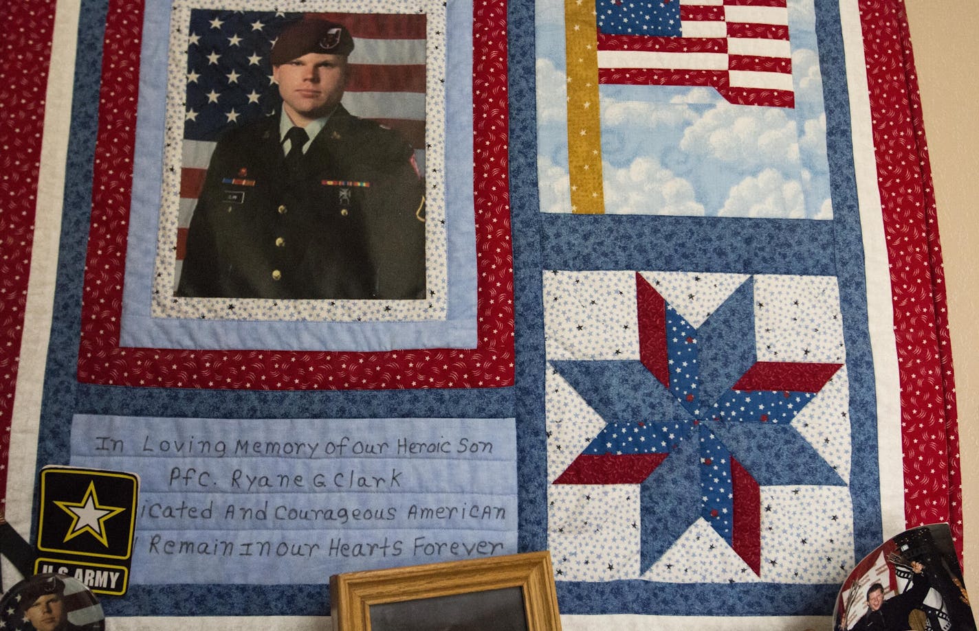 Ricky and Tracy Clark's home in New London, Minn., has become a tribute to their fallen son, Ryane, who died four years ago in Afghanistan. The Clarks hope to build a parking lot at an adjacent state trail in Ryan's honor.