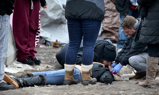 A man administered mouth-to-mouth resuscitation to a woman who had apparently overdosed on opioids Wednesday at the homeless camp in south Minneapolis before Natives Against Heroin volunteers arrived with a Narcan shot to revive her.