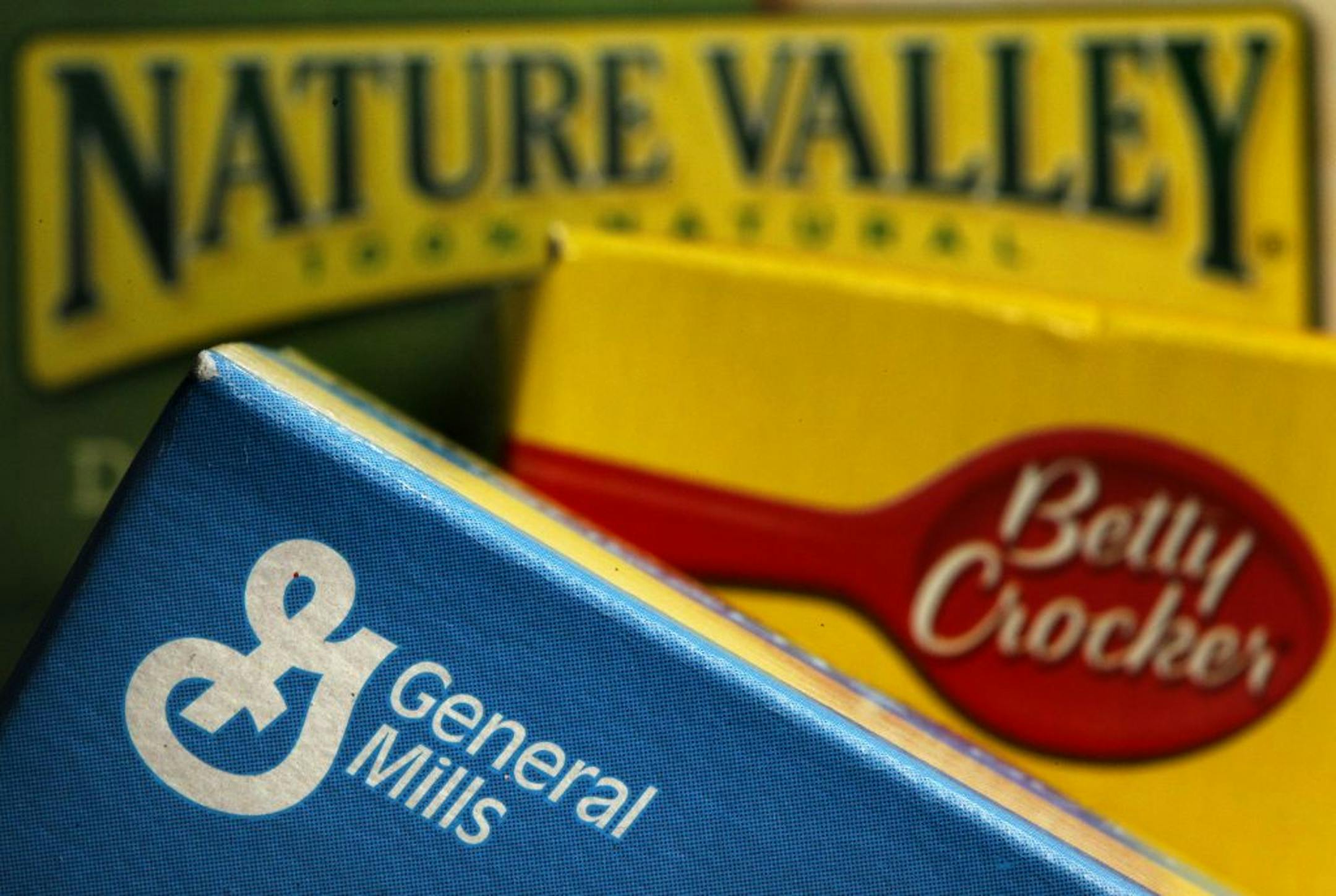 FILE - In this Sept. 20, 2011 file photo, General Mills products are displayed including Fiber One cereal, Betty Crocker Fruit Gushers snack, and Nature Valley granola bars, in Philadelphia. General Mills Inc.�s fiscal second-quarter net income slipped 28 percent, pressured by increased costs and some charges.