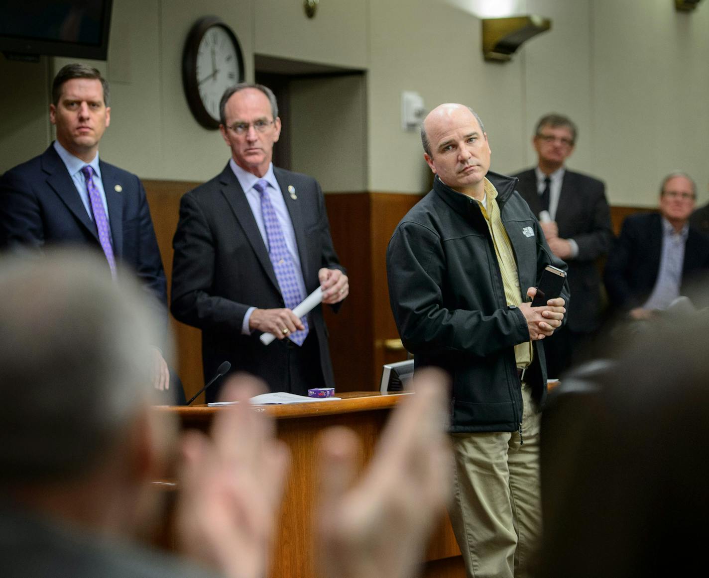 John Burkel, center, was invited to speak to the House Republican caucus at the state legislature to give representatives a first person account of what farmers are facing during the avian flu crisis. He received a standing ovation and answered questions from the members. Behind him are House Speaker Kurt Daudt and his local representative Dan Fabian, R-Roseau. ] GLEN STUBBE * gstubbe@startribune.com Friday, April 24, 2015 MN turkey farmer, John Burkel, who's flock was wiped out by the bird flu.