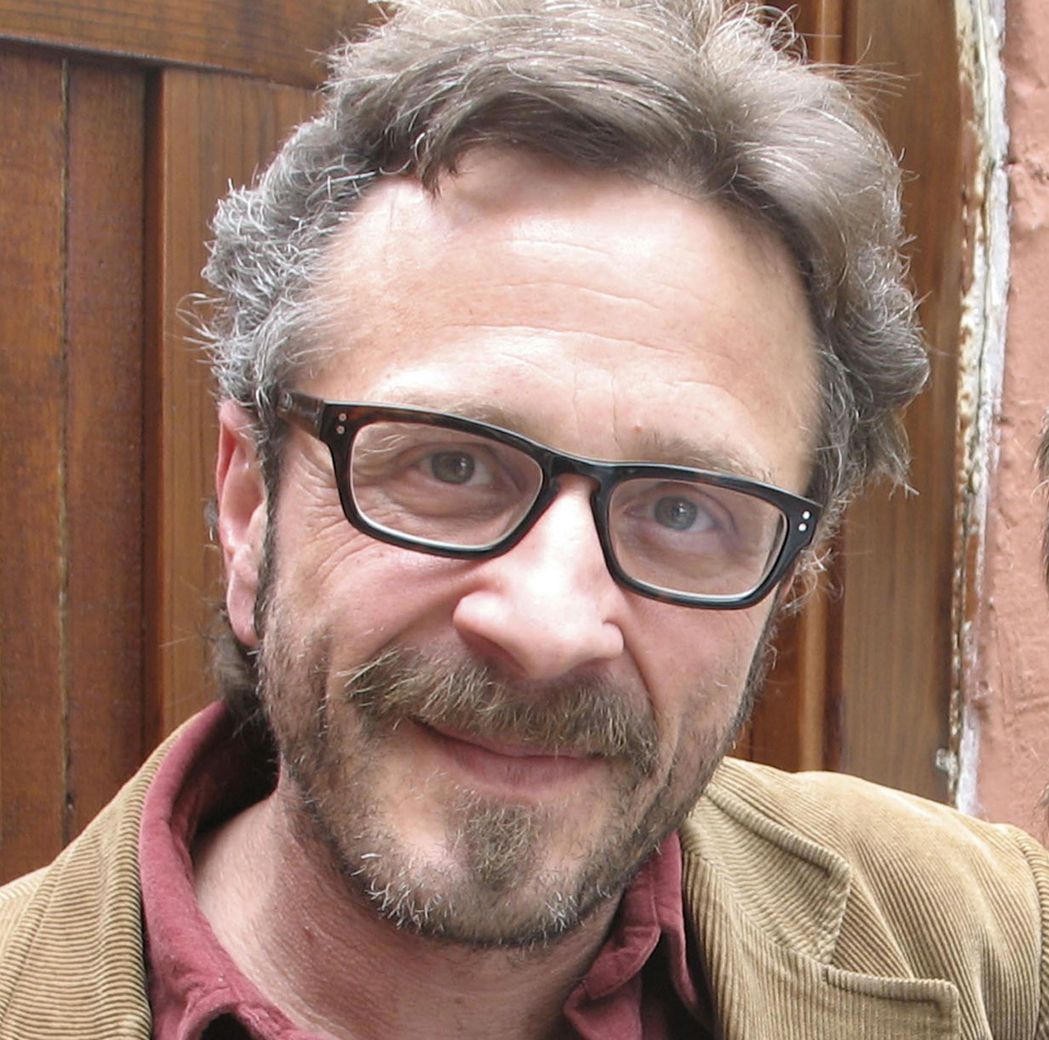 Marc Maron, left, with Ben Stiller in an undated handout photo. Maron runs a cult-hit podcast, on which he gets other comedians to reveal surprising details from their lives. (The New York Times) -- MAGS OUT/NO SALES; FOR EDITORIAL USE ONLY WITH STORY SLUGGED COMICS PODCAST ADV09 BY DAN SALTZSTEIN. ALL OTHER USE PROHIBITED. -- PHOTO MOVED IN ADVANCE AND NOT FOR USE - ONLINE OR IN PRINT - BEFORE JAN. 9, 2011.