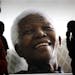 Giant photographs of former president Nelson Mandela are displayed at the Nelson Mandela Legacy Exhibition at the Civic Centre in Cape Town, South Afr