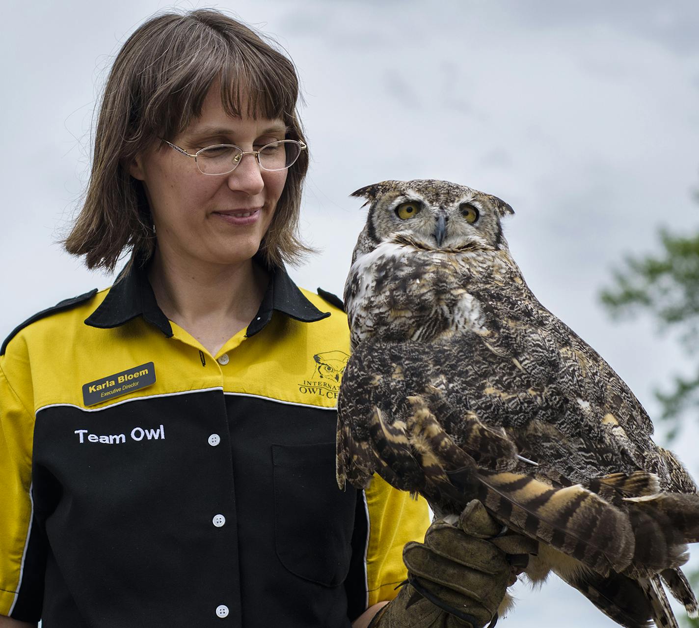 Karla Bloem, executive director of International Owl Center, and Alice the Great Horned Owl.