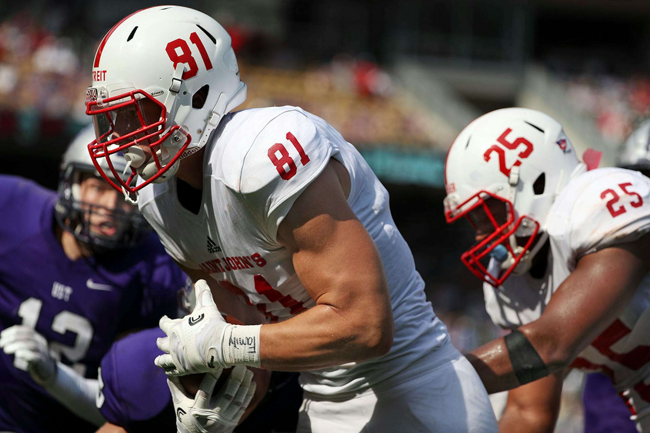 St. John's University tight end Jared Streit (81) ran the ball in for a touchdown off a long pass in the first half.