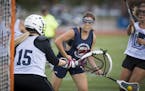 Kailey Heinl, center, scored during a recent summer league game. Heinl is one of 17 freshman recruits for the inaugural women&#x2019;s lacrosse team a