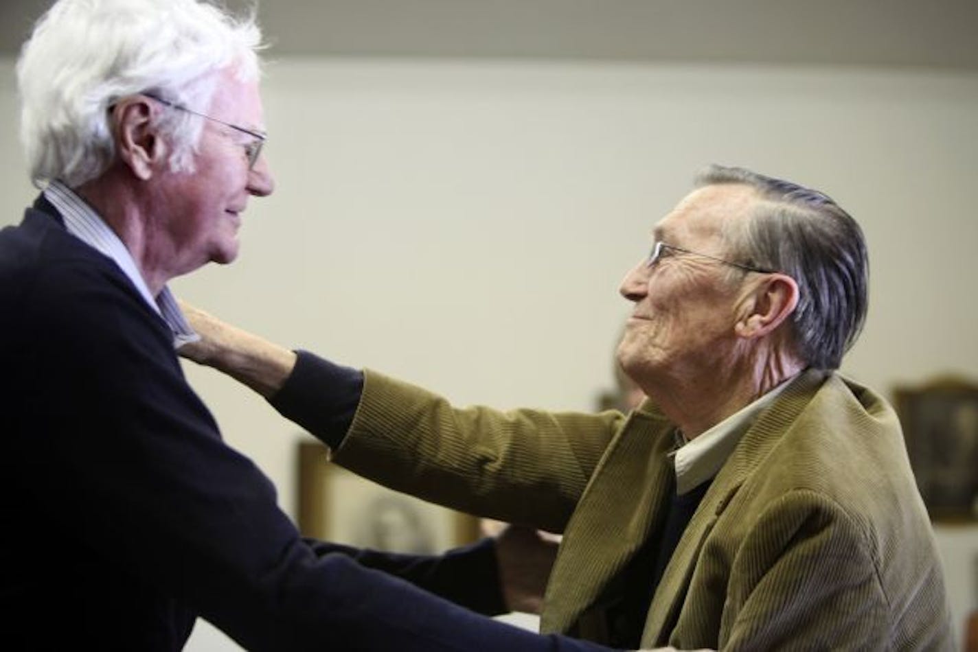 At a symposium for residents and fans of Robert Bly, Robert Bly and William Duffy who cofounded "The Fifties" the influential and groundbreaking poetry magazine embrace. "Who would have thought that two farm boys who cultivated corn and milked cows would become part of something so great?"