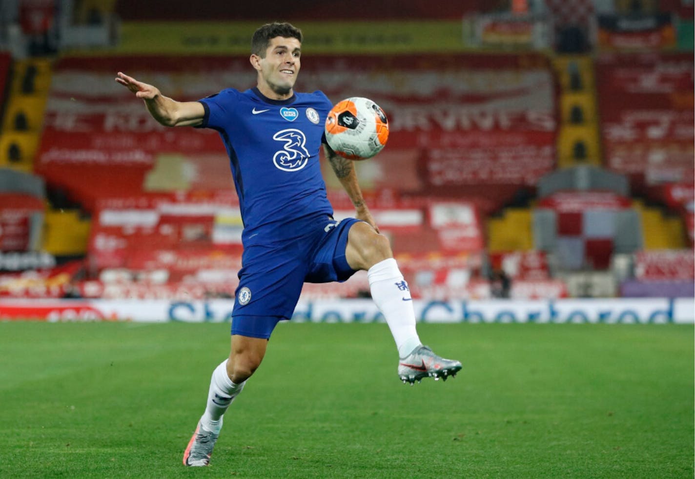 Chelsea's Christian Pulisic controls the ball during a July 22, 2020 Premier League soccer match between Liverpool and Chelsea at Anfield Stadium in Liverpool, England.Chelsea has recruited some big names to join the American star this season.