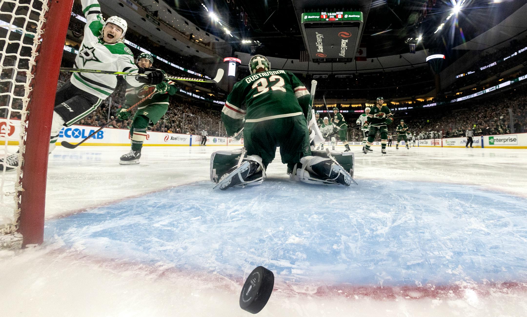 Roope Hintz (24) of the Dallas Stars celebrates after Evgenii Dadonov got the puck past Minnesota Wild goalie Filip Gustavsson (32) for a goal in the third period.