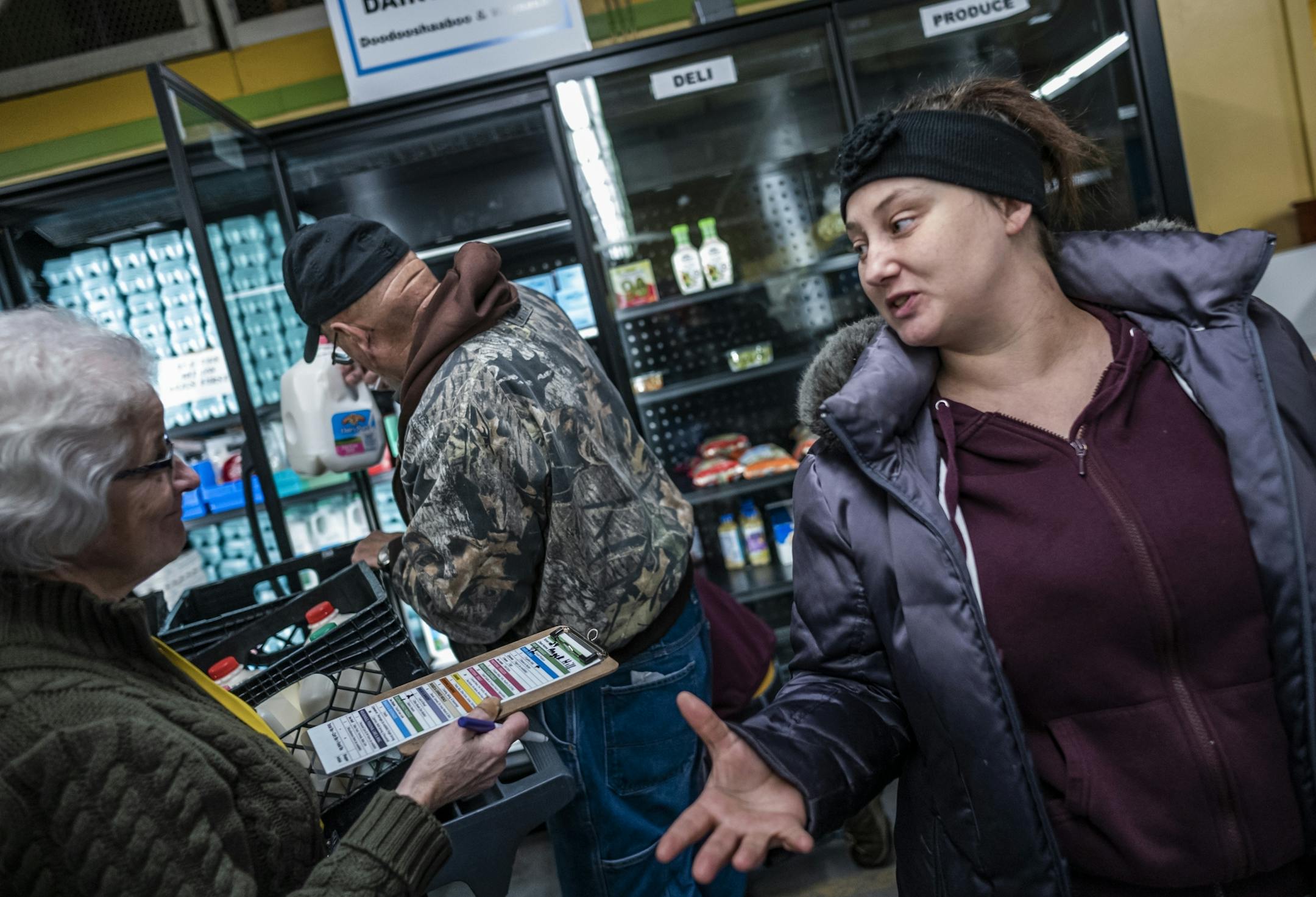 Angell Hill has no problems with refugees settling in Beltrami County. She finds the Bemidji Community Food Shelf to be a blessing. With the help of Barb Davidson, she picks out a basket of goods that help bridge the gap in her budget for food. She works as a personal care attendant.