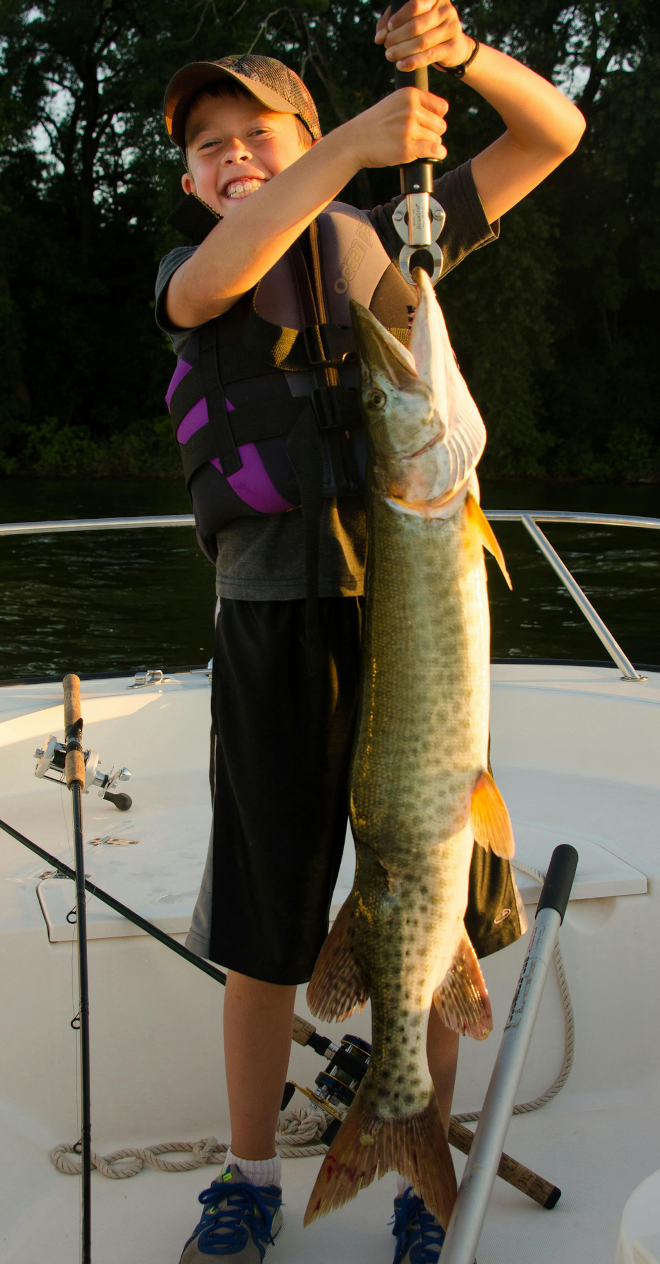 FIRST MUSKIE Noah Bartos, 8, of Chaska, caught and released his first muskie, a 38-incher, on Lake Waconia. "After netting it I noticed the injury to the fish,'' said his dad, John."I have to believe this happened when it was young, either from a boat prop or an attack from another fish. This deformity was completely healed.''