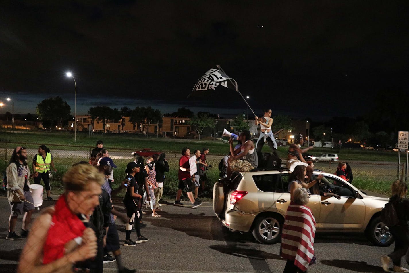 Supporters of Philando Castile held signs as they marched along the on ramp at Dale Ave headed towards I-94 in St. Paul, after leaving a vigil at the State Capitol. ] ANTHONY SOUFFLE • anthony.souffle@startribune.com Supporters of Philando Castile held a vigil after St. Anthony police officer Jeronimo Yanez was found not guilty of all counts in the fatal shooting Friday, June 16, 2017 at the State Capitol Building in St. Paul, Minn. ORG XMIT: MIN2017061620541352