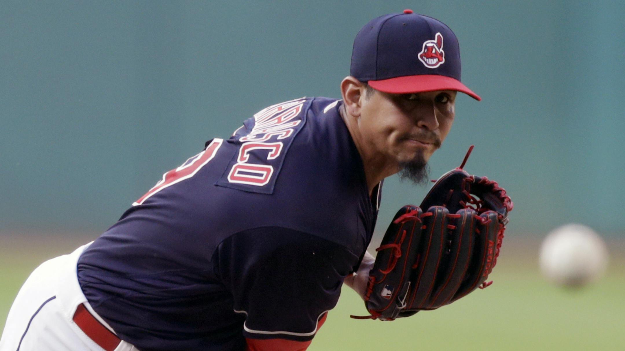 Cleveland Indians starting pitcher Carlos Carrasco delivers in the first inning of a baseball game against the Minnesota Twins, Tuesday, Aug. 28, 2018, in Cleveland. (AP Photo/Tony Dejak)