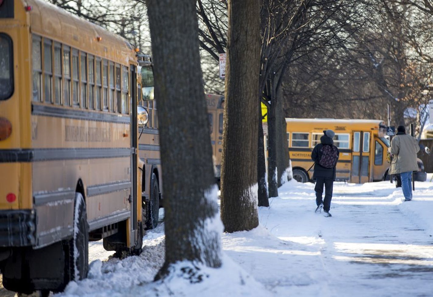 Students walked to their buses in the bitter cold after school at Sanford Middle School on Tuesday, January 16, 2018, in Minneapolis, Minn. Sanford and all other grades six through eight middle schools would be starting late at 9:30 a.m.