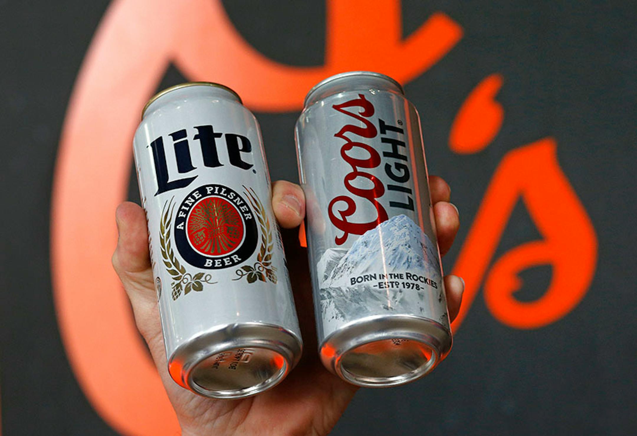 A vendor hawks beer before an opening day baseball game between the Baltimore Orioles and the Minnesota Twins in Baltimore, Monday, April 4, 2016. (AP Photo/Patrick Semansky)