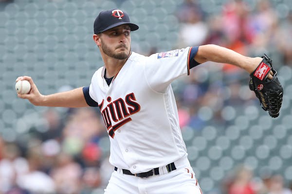 Minnesota Twins pitcher Buck Farmer throws against the Detroit Tigers in the first inning of a baseball game Sunday Aug. 19, 2018 in Minneapolis. (AP 
