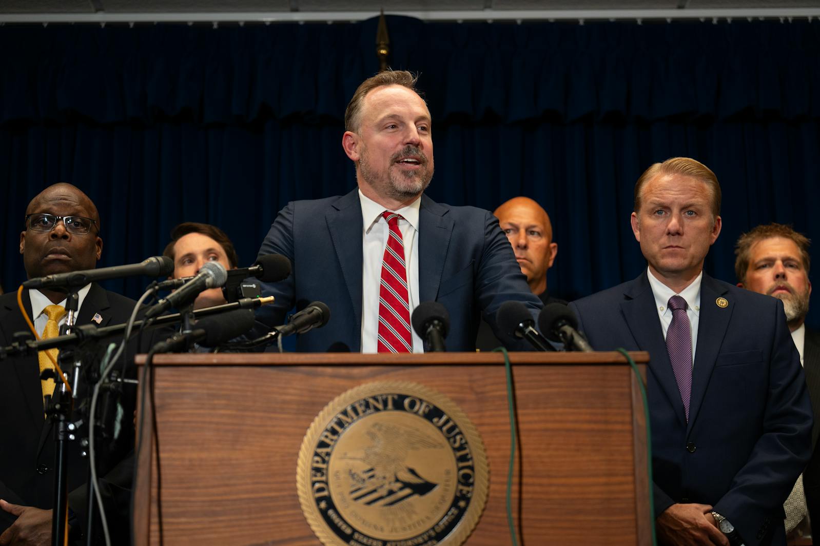 Acting U.S. Attorney Joseph H. Thompson announces expanded charges against accused murderer Vance Boelter during a news conference on Tuesday.