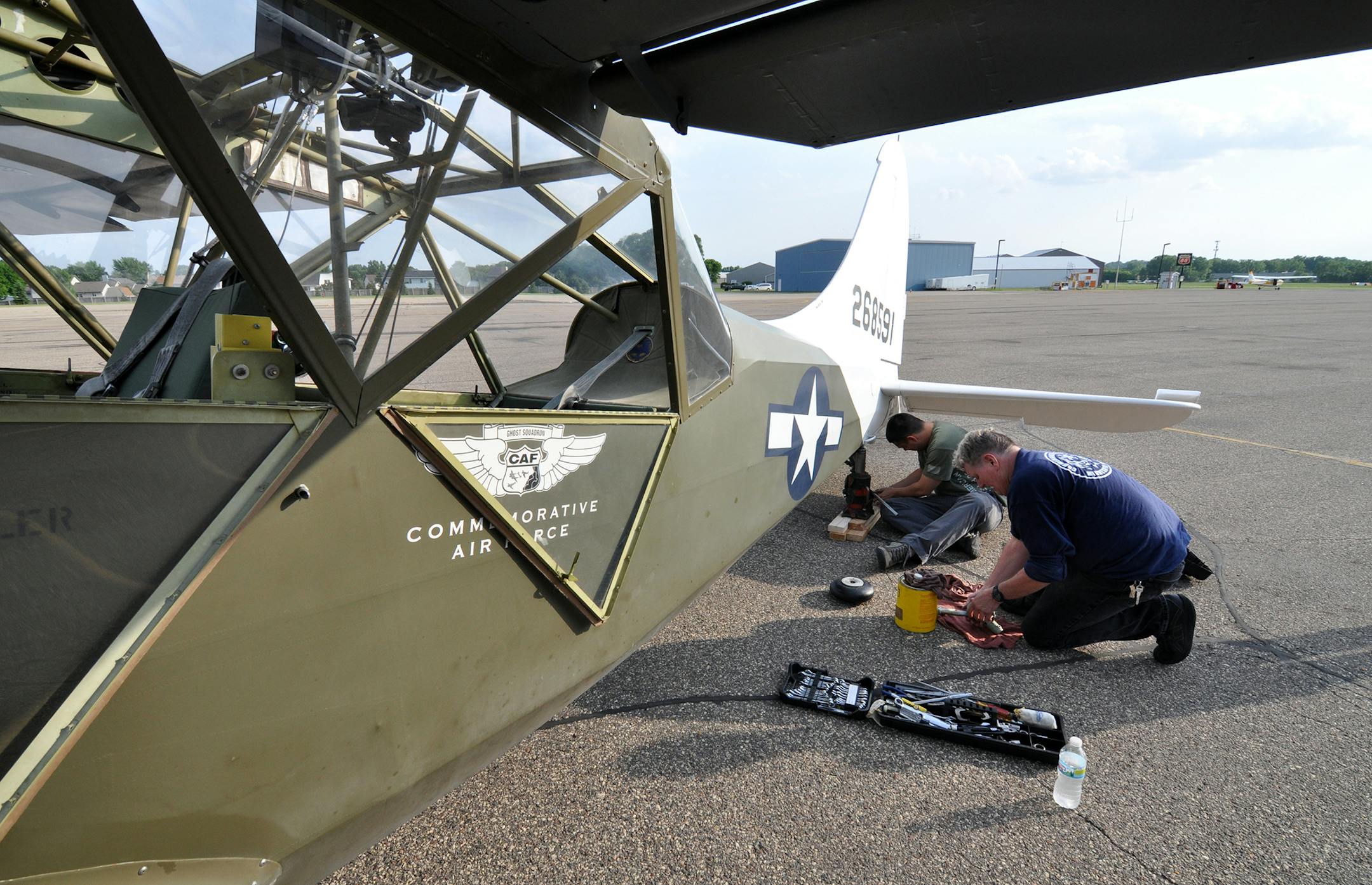 Jim Lauria of Inver Grove Heights and Randy ‚ÄúBiggs‚Äù Bigler of Prior Lake, both volunteers of the Minnesota Wing of the Commemorative Air Force Museum, worked on a Stintson L-5 Sentinel.