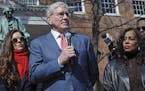 Charles Taney III, a descendant of U.S. Supreme Court Chief Justice Roger Taney, center, offers apology to Lynne Jackson, a descendant of Dred Scott, 