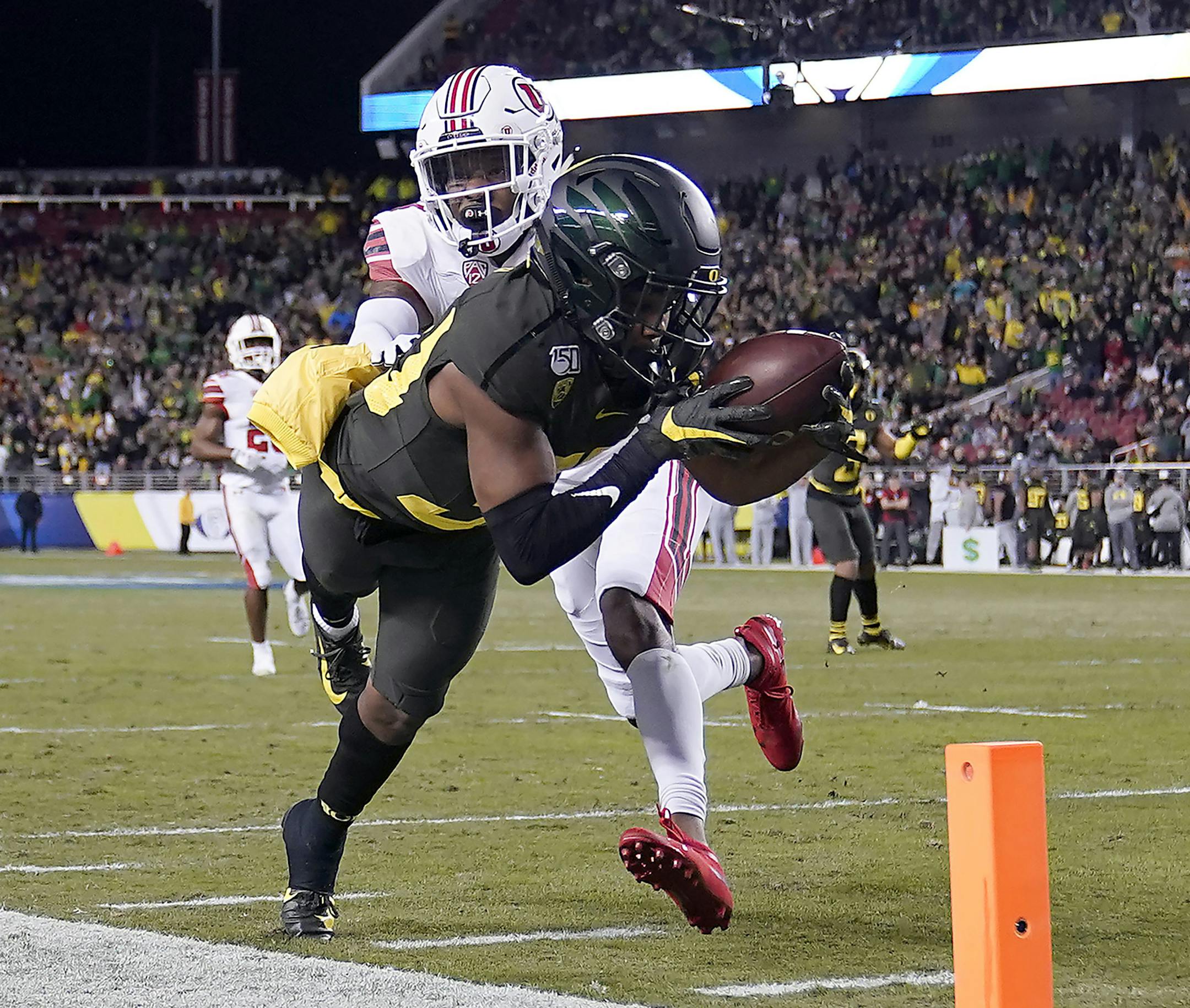 Oregon wide receiver Jaylon Redd (30) is pushed out of bounds by Utah defensive back Josh Nurse (14) short of the goal line during the first half of the Pac-12 Conference championship NCAA college football game in Santa Clara, Calif., Friday, Dec. 6, 2018. (AP Photo/Tony Avelar)