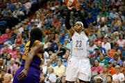 Minnesota Lynx forward Maya Moore (23) shoots the ball against Los Angeles Sparks forward Nneka Ogwumike (30) during the first half of a WNBA basketba