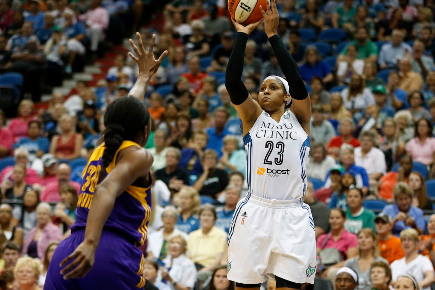 Minnesota Lynx forward Maya Moore (23) shoots the ball against Los Angeles Sparks forward Nneka Ogwumike (30) during the first half of a WNBA basketball game, Wednesday, July 29, 2015, in Minneapolis. (AP Photo/Stacy Bengs)