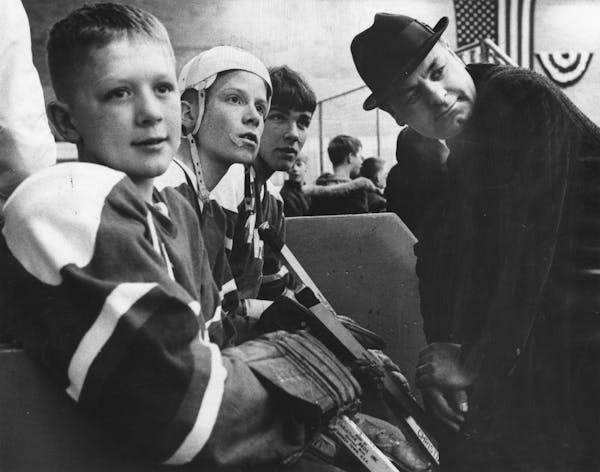 Mar. 7, 1968: Hockey coach Dick Roberts with Alan Hangsleben, 12, Dick Ellerbusch, 13, and Lee Moyer, 14.