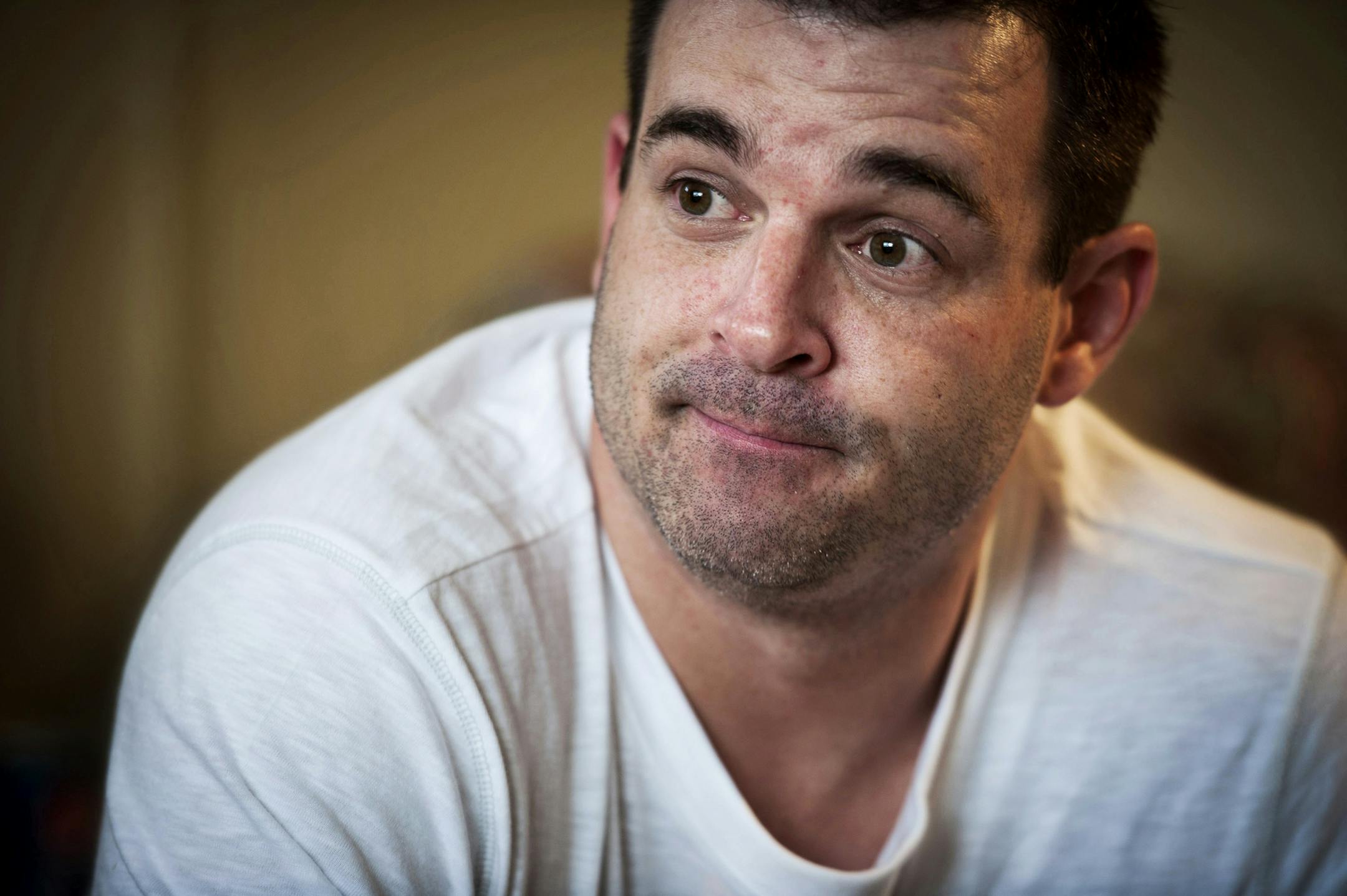 FILE - In this Dec. 14, 2012 file photo, Ryan Larson speaks during an interview. A Minnesota jury ruled Monday, Nov. 21, 2016, against Larson, who sued two media organizations over news stories that named him as a suspect in the 2012 killing of a Cold Spring, Minn., police officer. Larson accused the two outlets of defamation. He was arrested on suspicion of murder, but was released without charges. (Glen Stubbe/Star Tribune via AP, File)