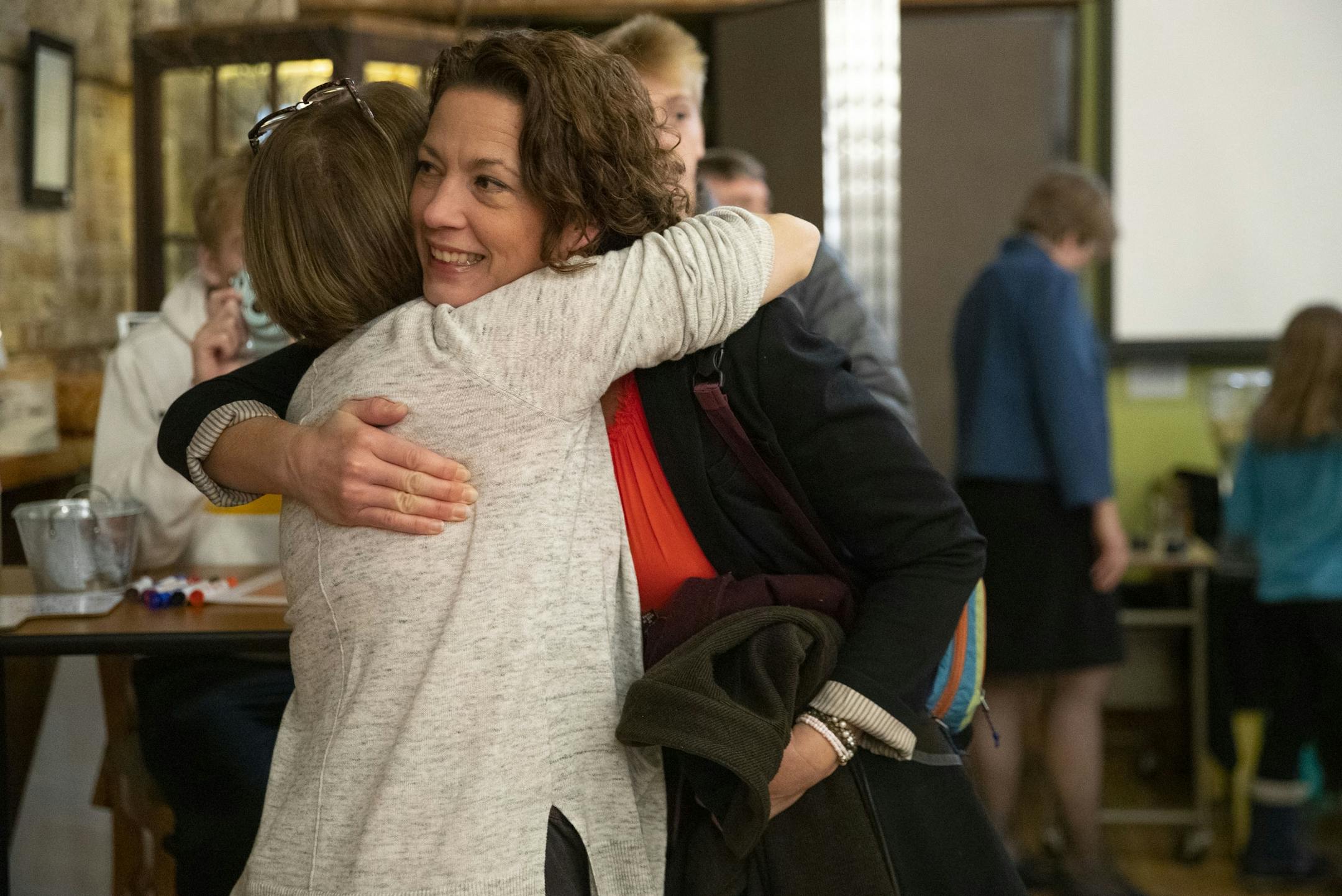 Duluth incumbent Mayor Emily Larson hugged her close friend, Lynn Goerdt, at the start of her results watch party at the Duluth Folk School on Tuesday night.