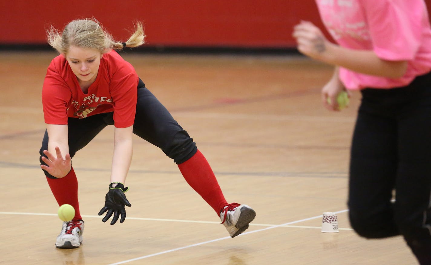 Marie Deaton prepared to catch a bouncing ball during practice. ] (KYNDELL HARKNESS/STAR TRIBUNE) kyndell.harkness@startribune.com Practice of the Elk River softball team that are defending Class 3A state softball champion in Elk River, Min, day, April 3, 2014.