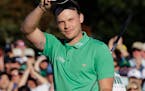 Danny Willett waved to the gallery after putting out on the 18th hole during Sunday's final round of the Masters. Willett shot a 5-under-par 67.