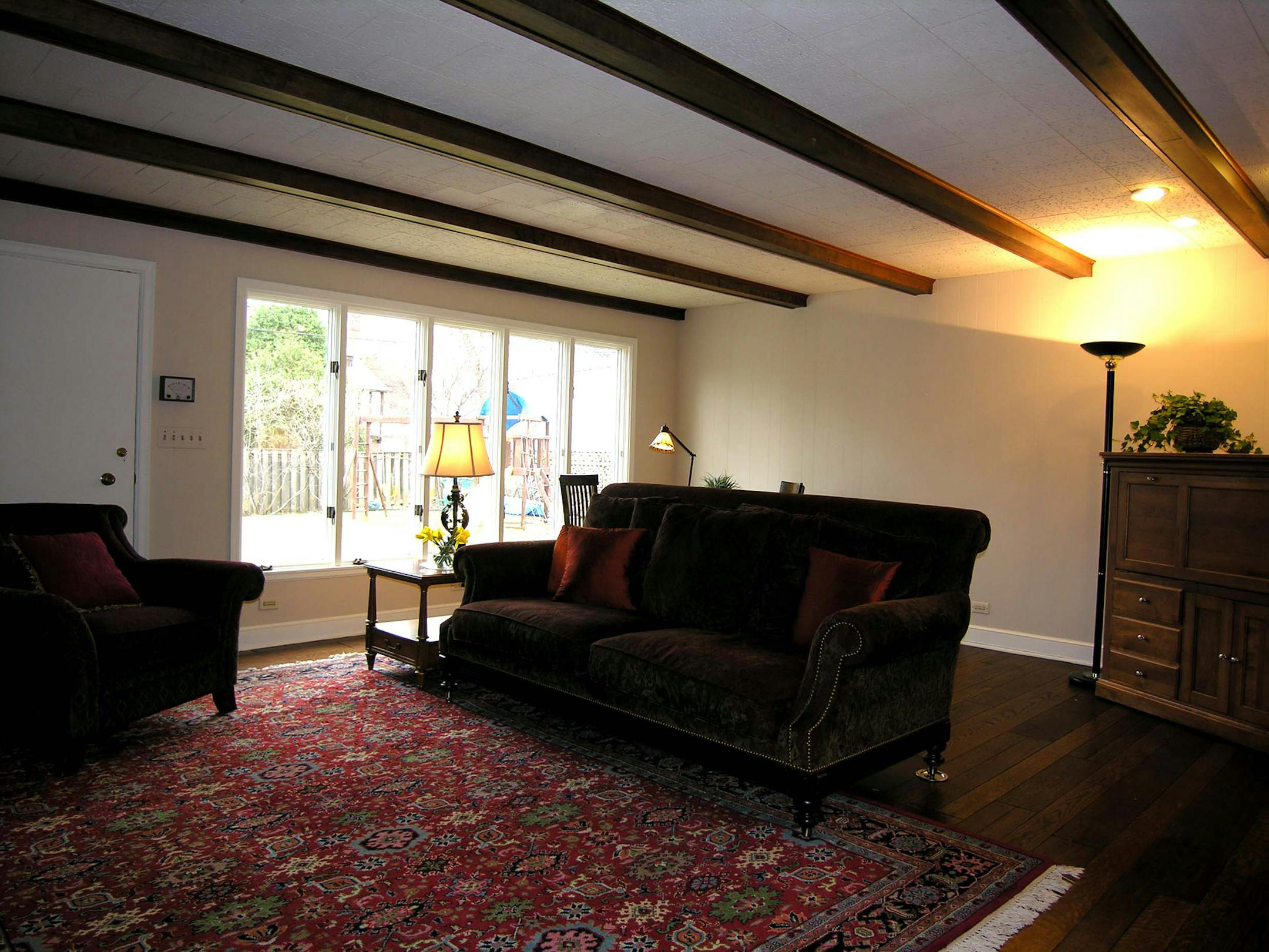The paneling was painted a sandstone color to lighten the room.