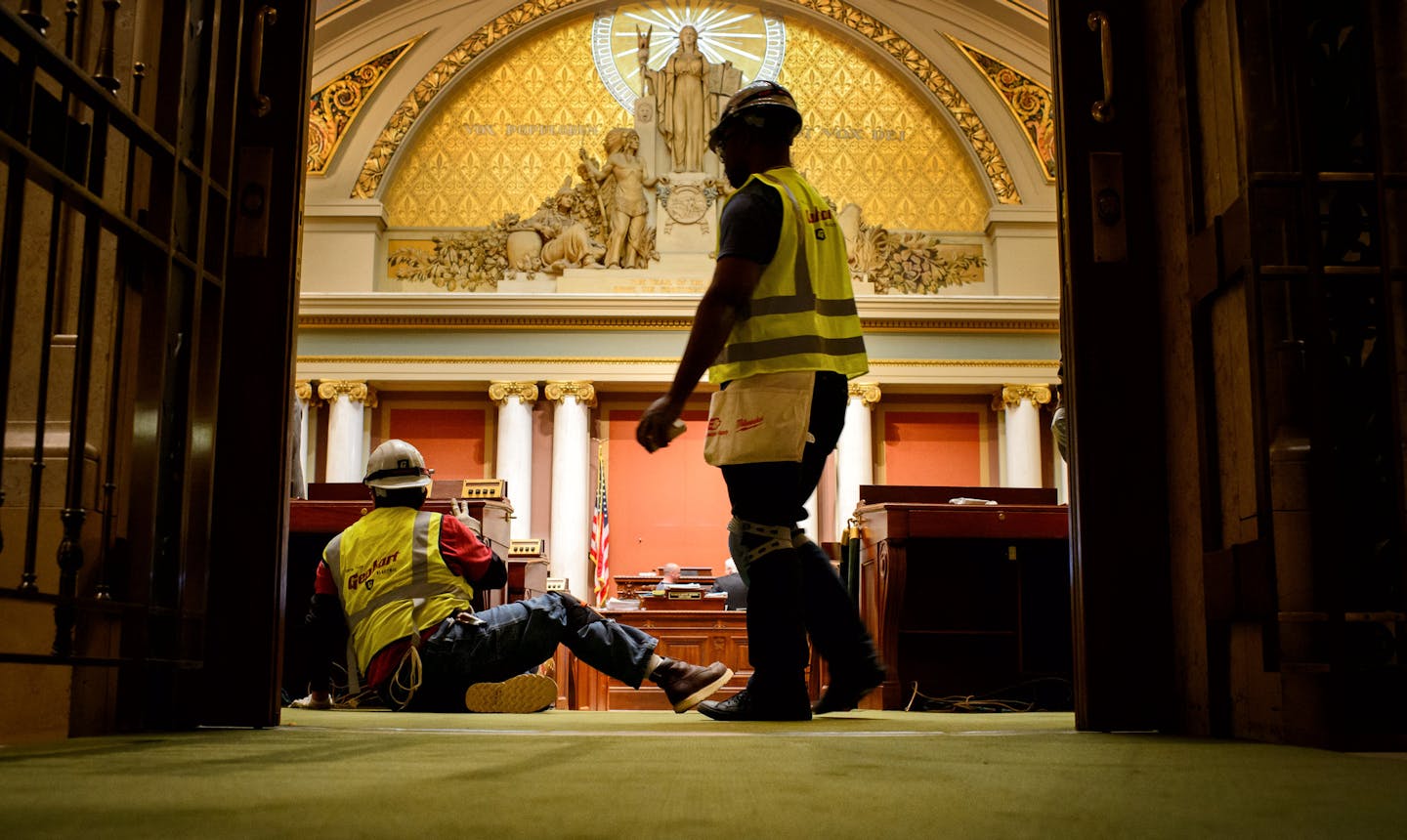 Crews removed desks in the House Chamber. ] GLEN STUBBE * gstubbe@startribune.com , Tuesday, May 19, 2015 Crews wasted no time clearing out furniture and artwork from the Minnesota State Capitol just hours after it was vacated by lawmakers who ended their session at midnight Monday.