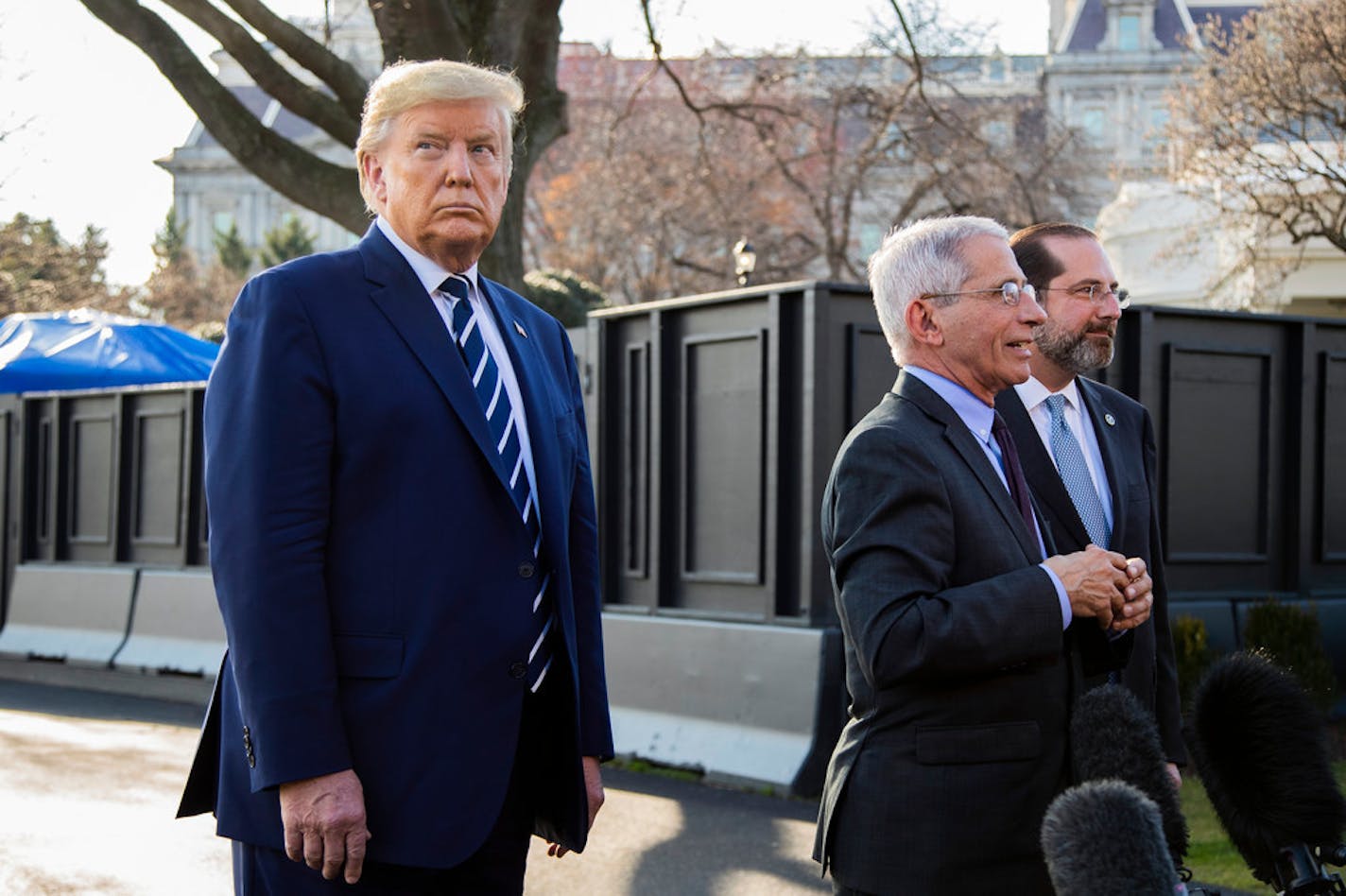 President Donald Trump with Director of the National Institute of Allergy and Infectious Diseases at the National Institutes of Health Anthony Fauci, center, and Department of Health and Human Services Secretary Alex Azar.