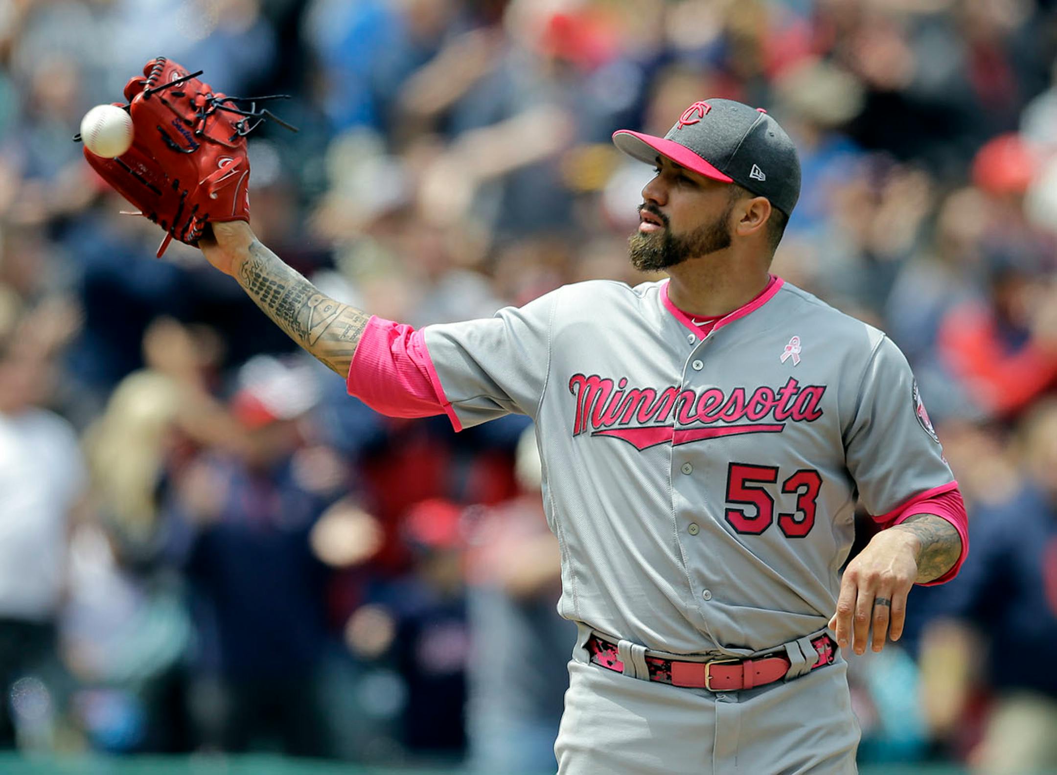 Minnesota Twins' Hector Santiago gets another ball and waits for Cleveland Indians' Lonnie Chisenhall to run the bases after Chisenahall hit a two-run home run in the second inning of a baseball game, Sunday, May 14, 2017, in Cleveland.