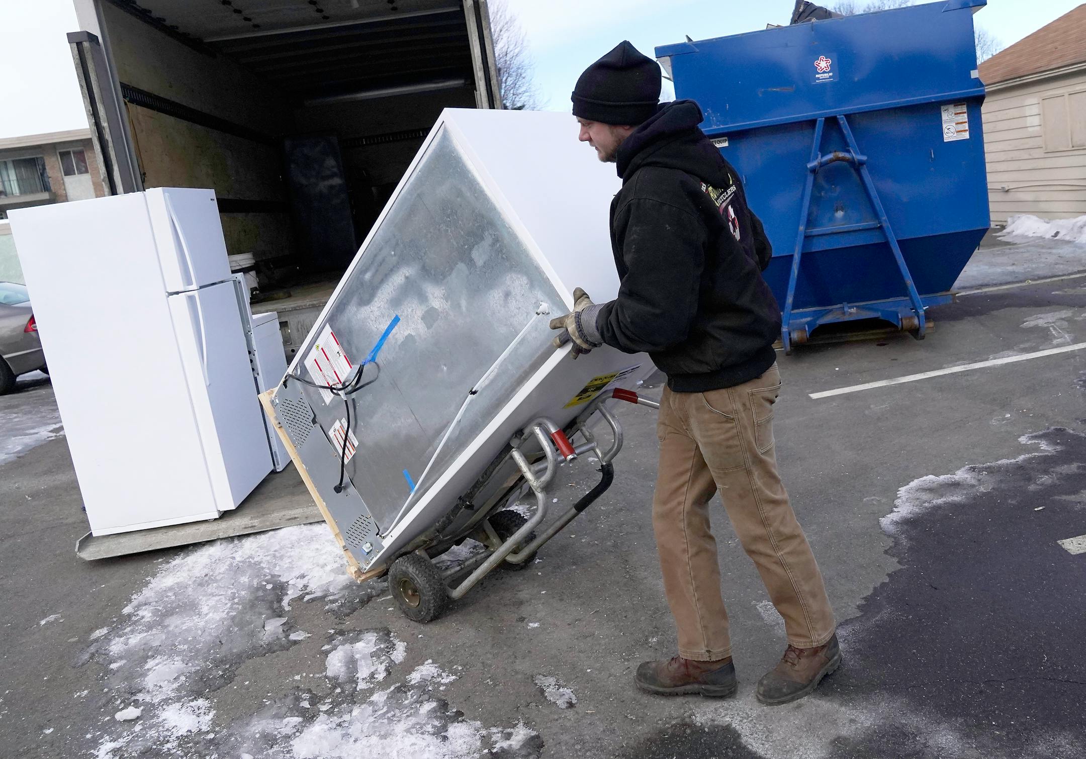 J.R.'s Advanced Recyclers driver Jake Gimberlin collects old appliances, including refrigerators with hydroflurocarbon-based refrigerants.