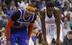 New York Knicks forward Carmelo Anthony (7) smiles at a fan as he waits for a foul shot with Oklahoma City Thunder forward Jerami Grant (9) in the fou