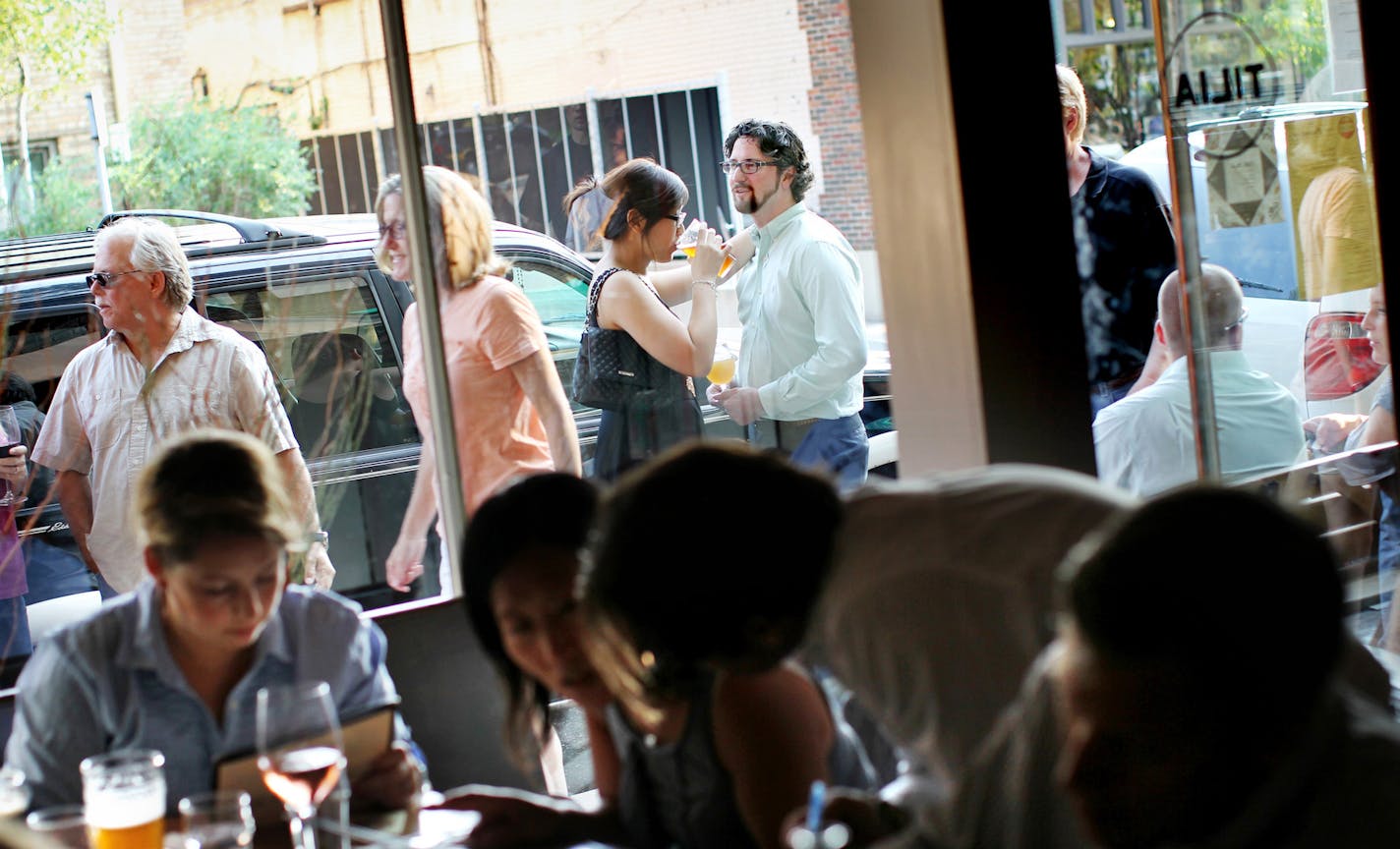 Sook Jin Ong (center, in black dress) and John Mathews waited for a table at Tilia one Friday night in Linden Hills. There&#x2019;s no off-street parking, much to neighbors&#x2019; chagrin.