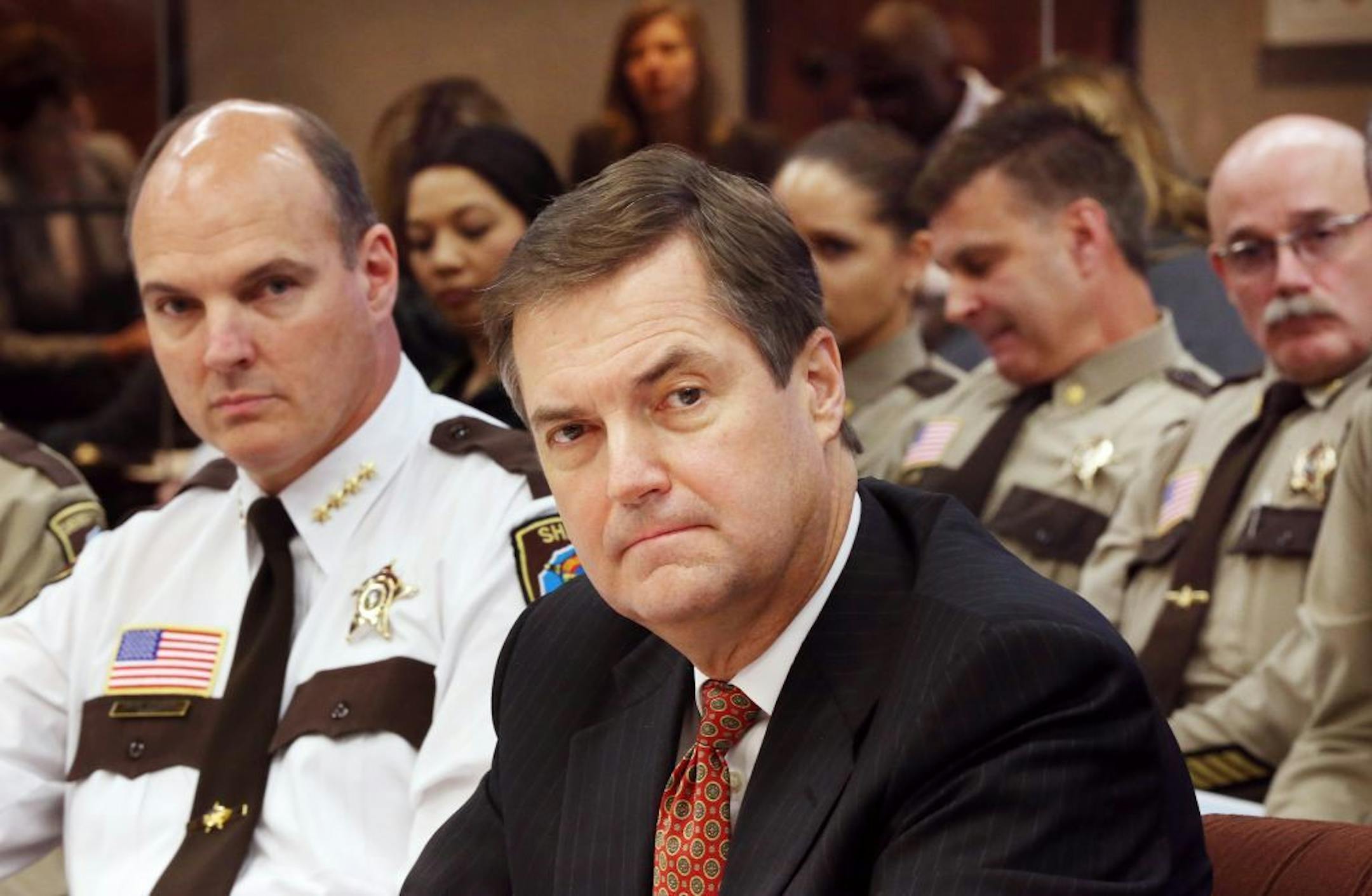 Hennepin County Sheriff Rich Stanek, left, and Hennepin County Administrator David Hough spoke Thursday in Minneapolis at a board meeting that discussed overtime within the Sheriff's Office.