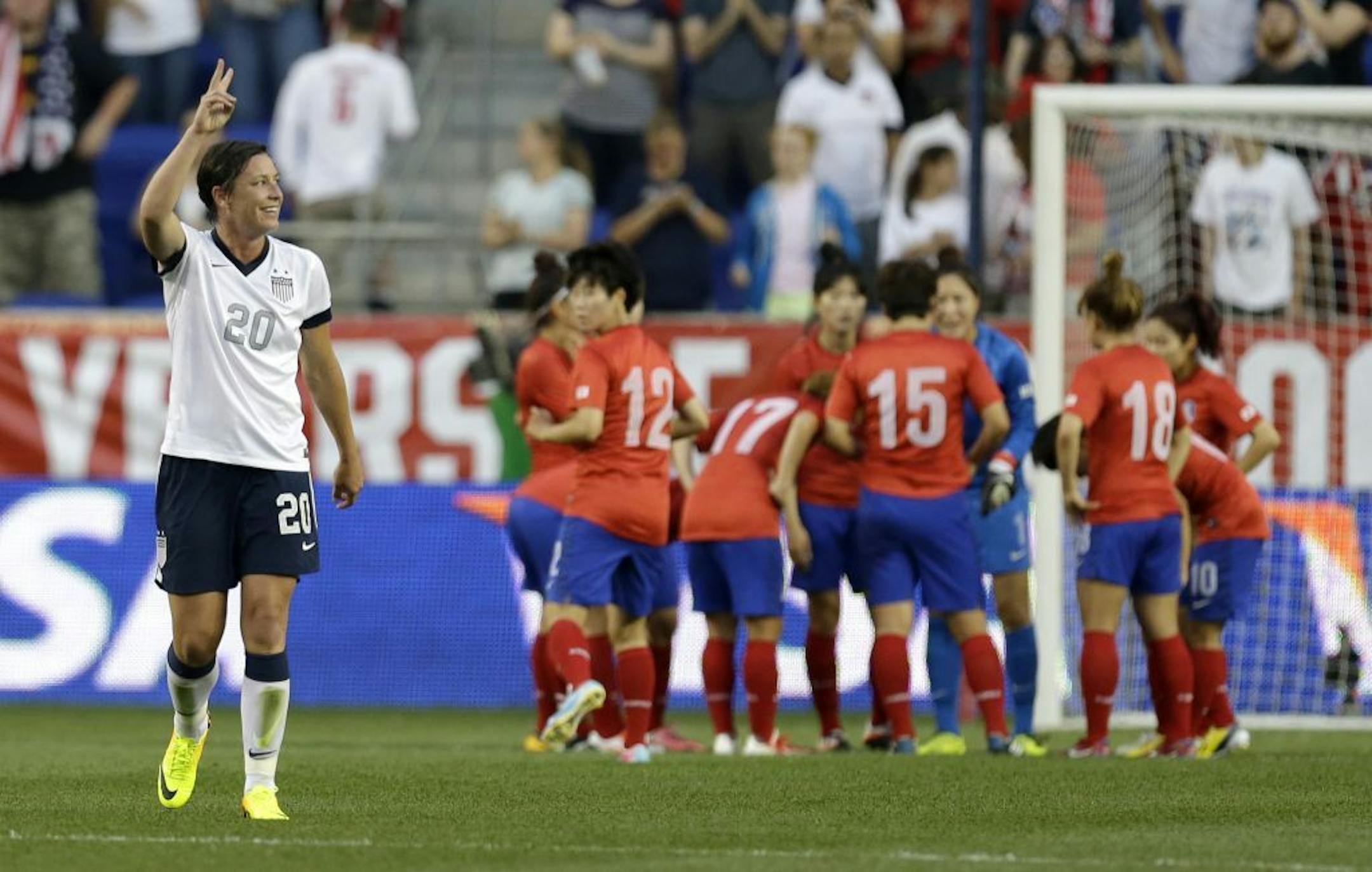 Abby Wambach reacts after scoring a goal against South Korea during the first half of an international friendly soccer match. With the goal, Wambach tied Mia Hamm's record for international career goals by a soccer player.