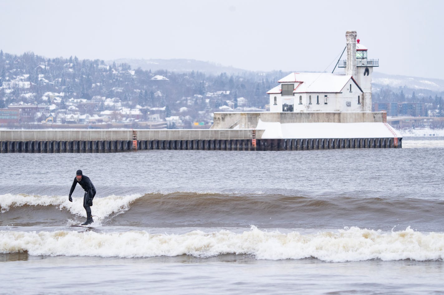 John Oldenborg surfs on small waves in Lake Superior Thursday, Jan. 11, 2024 in Duluth, Minn.   ]

ALEX KORMANN • alex.kormann@startribune.com