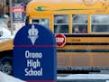 Orono High School students arrived by bus at the school Thursday, a day after a threat was posted, causing Orono schools to go on lockdown.