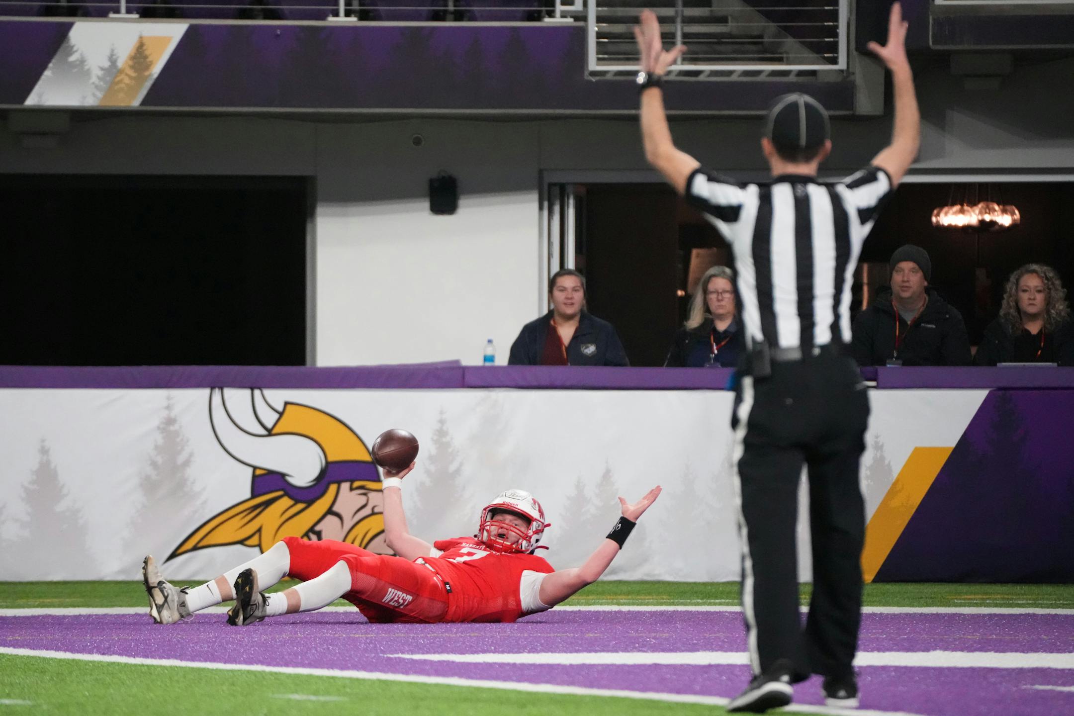 In a play overruled by officials, Mankato West's quarterback Barton McAninch (7) appears to have scored a touchdown in the first half of the Minnesota High School football Class 5A State Championship at U.S. Bank Stadium in Minneapolis, Minn., on Saturday, Dec. 3, 2022.