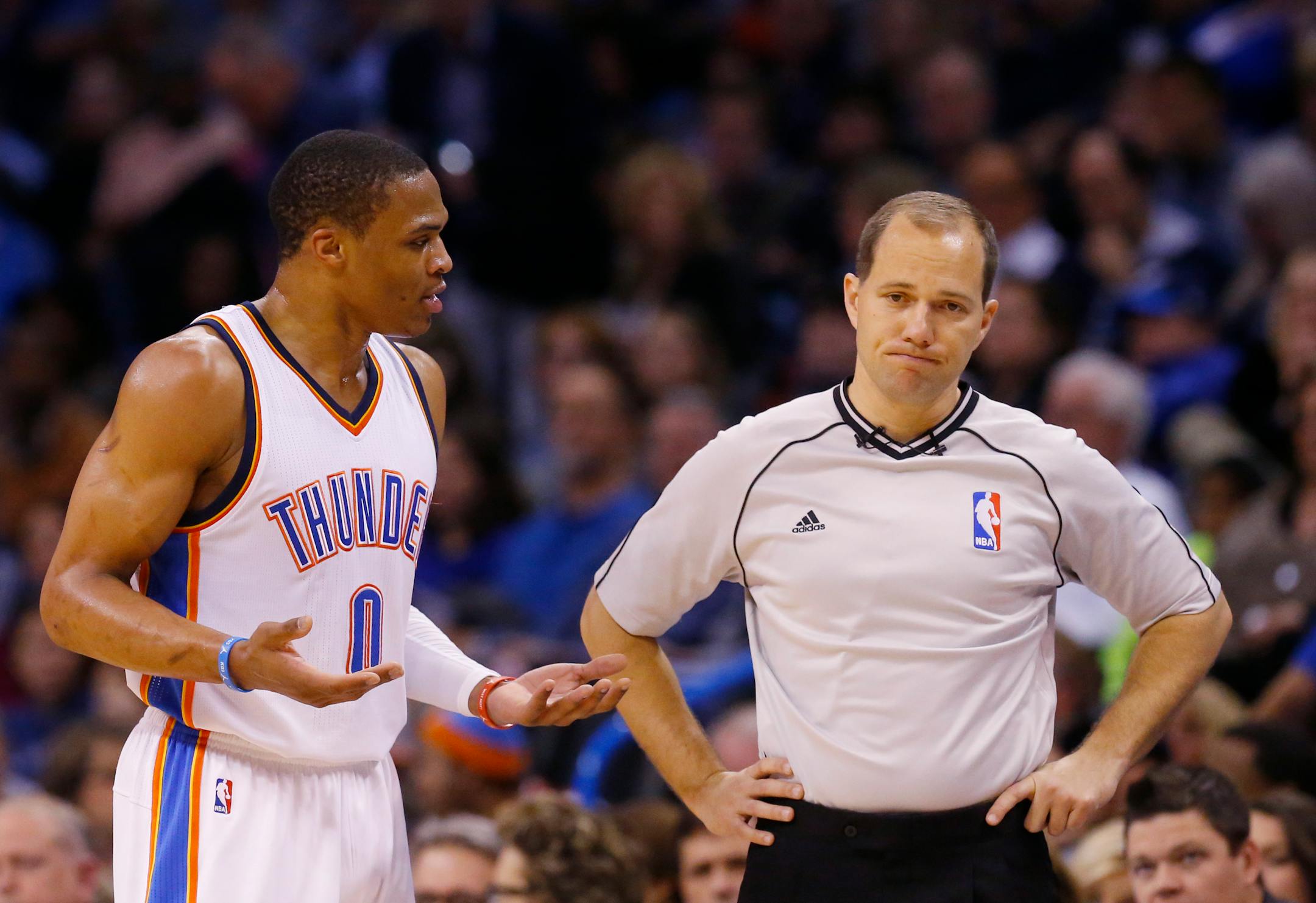 Oklahoma City Thunder guard Russell Westbrook (0) disputes a technical foul call with official John Goble, right, in the third quarter of an NBA basketball game in Oklahoma City, Tuesday, Feb. 24, 2015. Oklahoma City won 105-92. (AP Photo/Sue Ogrocki)