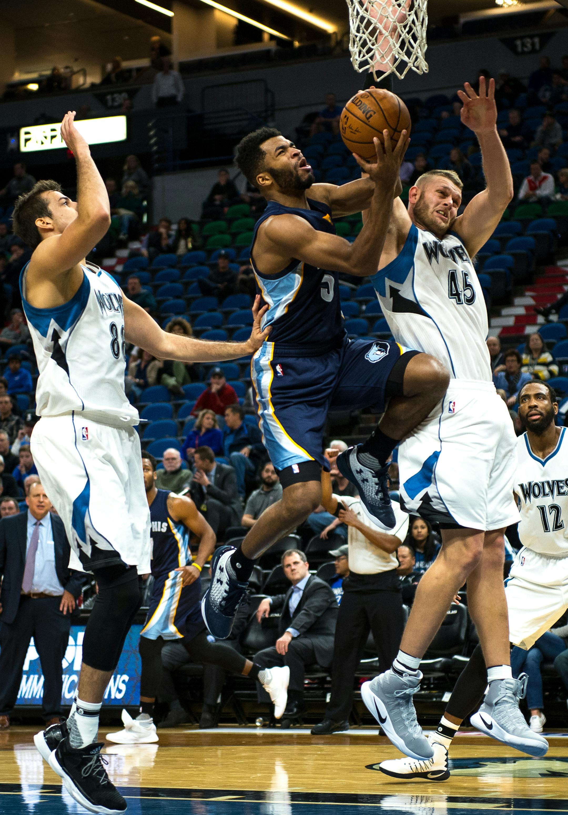Memphis Grizzlies guard Jordan Adams (3) unsuccessfully drove toward the basket for a layup under the defense of Minnesota Timberwolves forward Nemanja Bjelica (88) and center Cole Aldrich (45) in the fourth quarter. ] (AARON LAVINSKY/STAR TRIBUNE) aaron.lavinsky@startribune.com The Minnesota Timberwolves played the Memphis Grizzlies in a preseason game on Wednesday, Oct. 19, 2016 at Target Center in Minneapolis, Minn.