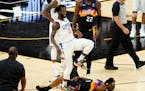 Los Angeles Clippers guard Patrick Beverley (21) smiles after fouling Phoenix Suns guard Chris Paul (3) during the second half of game 5 of the NBA ba