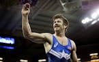 Minnesota Storm's Andy Bisek celebrates his victory over Geordan Speiller in 75kg Greco Roman wrestling for a spot on the Olympic team.