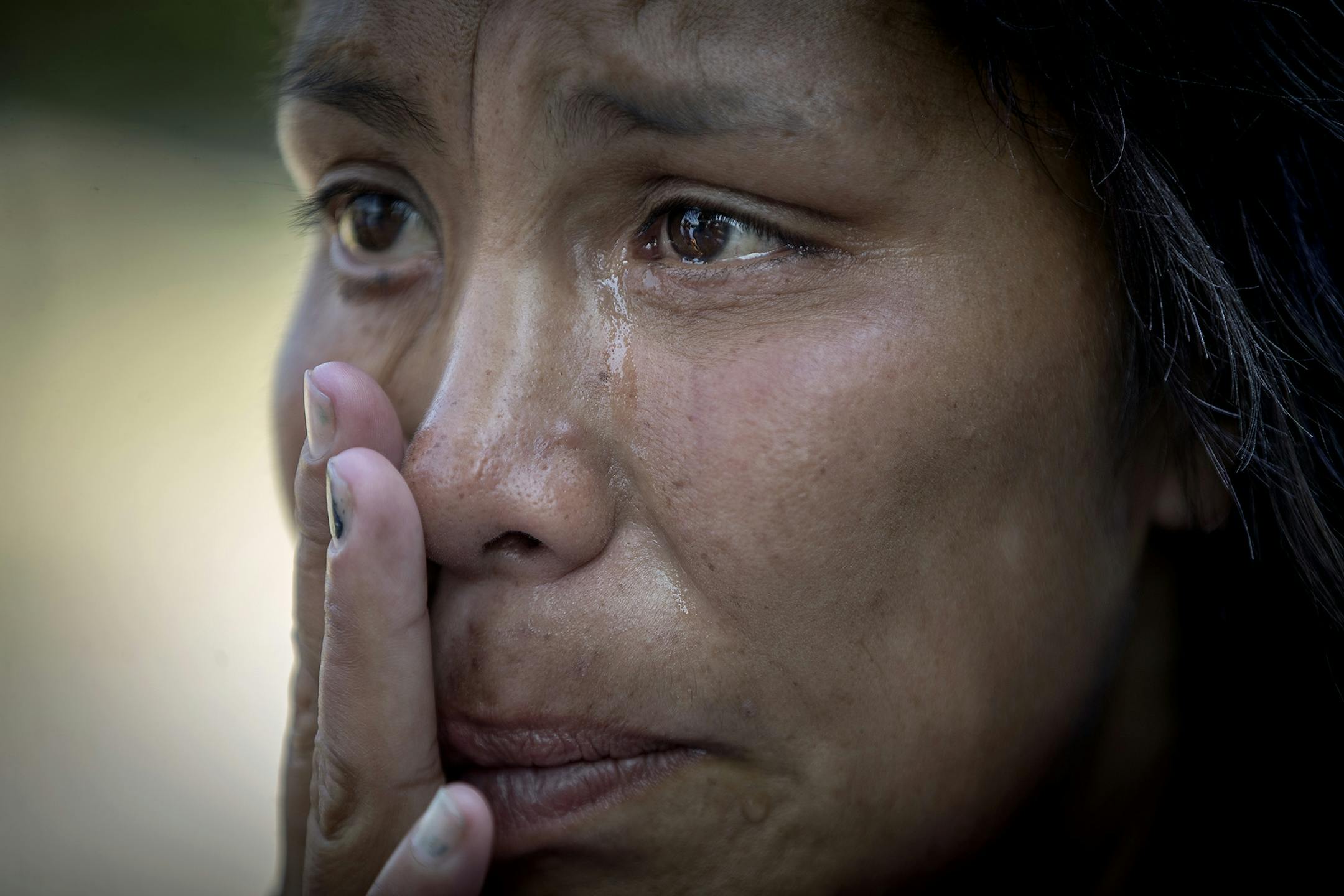 "All I want is a tent," said Tiffany DeCoteau as she cried out during the officials' visit Wednesday to the encampment, near E. Franklin and Hiawatha avenues.