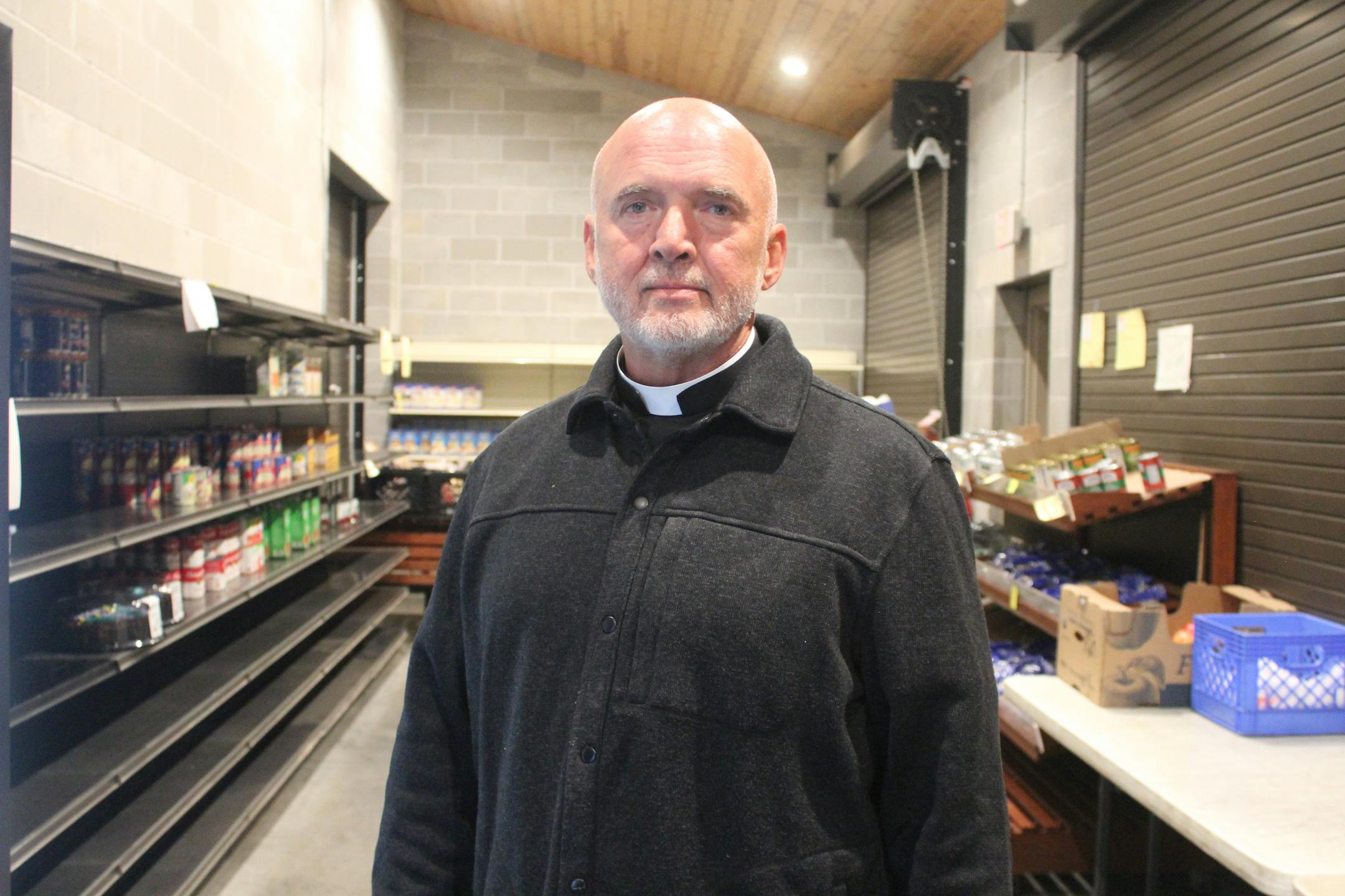 Gethsemane Lutheran Church Pastor Jeff Nehrbass pictured in front of the church's food shelf